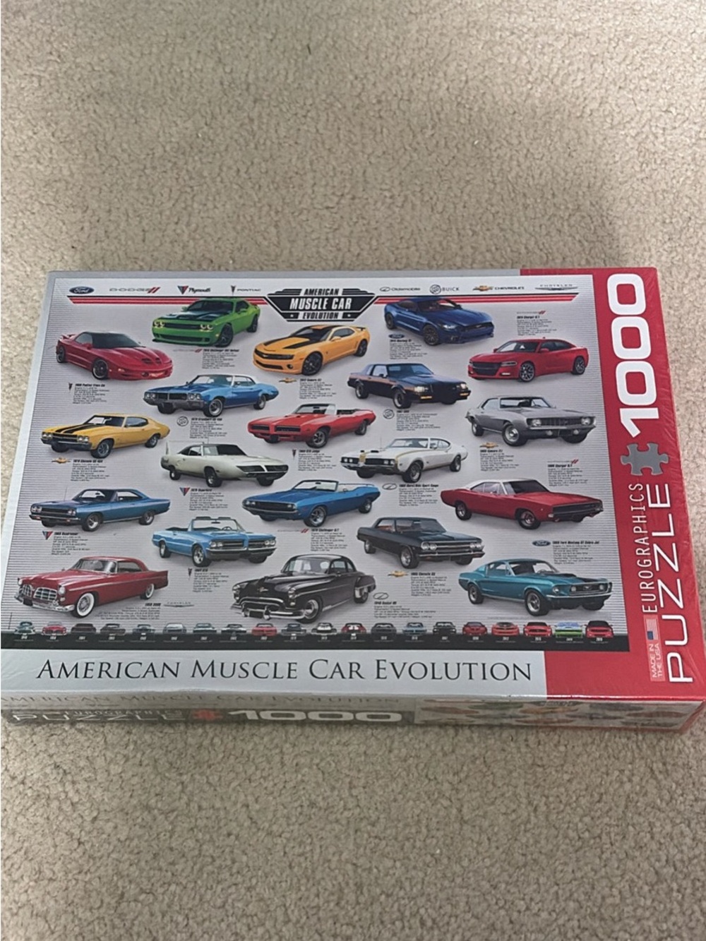 NEW. American  Muscle Car Evolution 1000-Piece Puzzle - Assorted Car Color